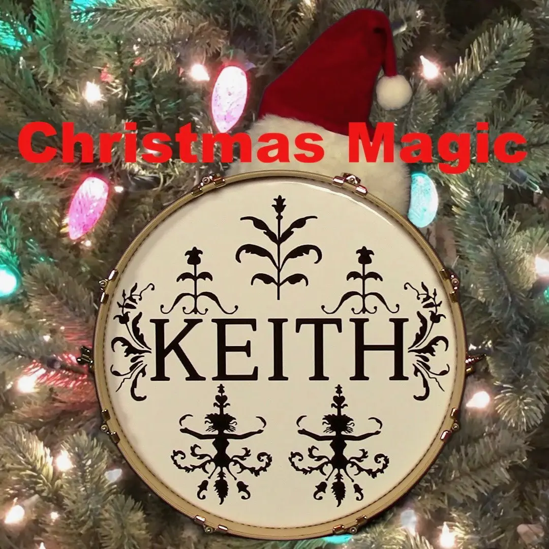 A christmas ornament that says keith in the middle of a tree.